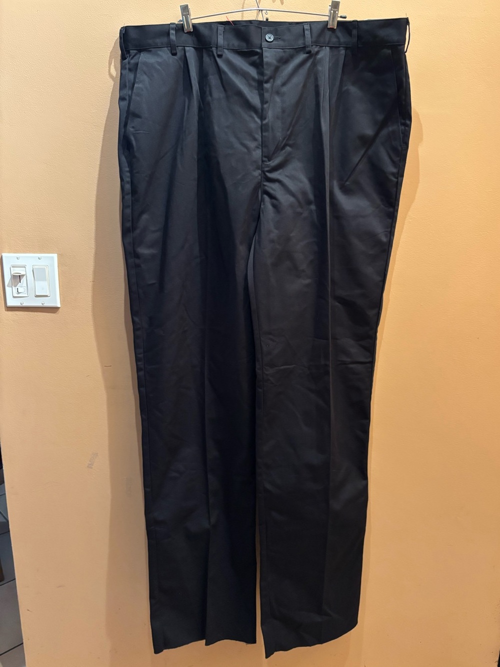 Edward’s classic black pleated dress pants with a straight-leg design size 44